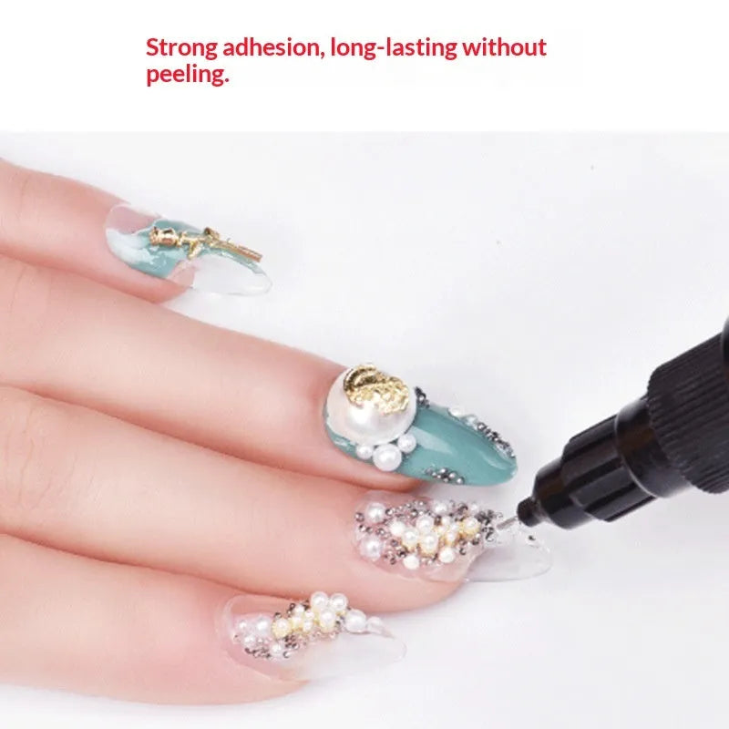 Nail art no-wash gem glue bottle with three iron tube dotting pens on black background