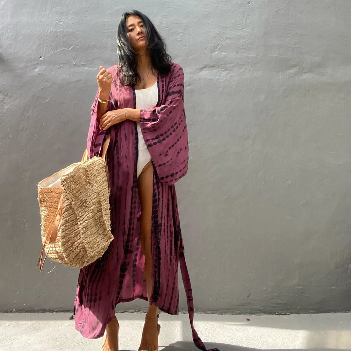 Loose-fitting cotton beach cover-up blouse in a printed pattern, shown in a rust red colour.