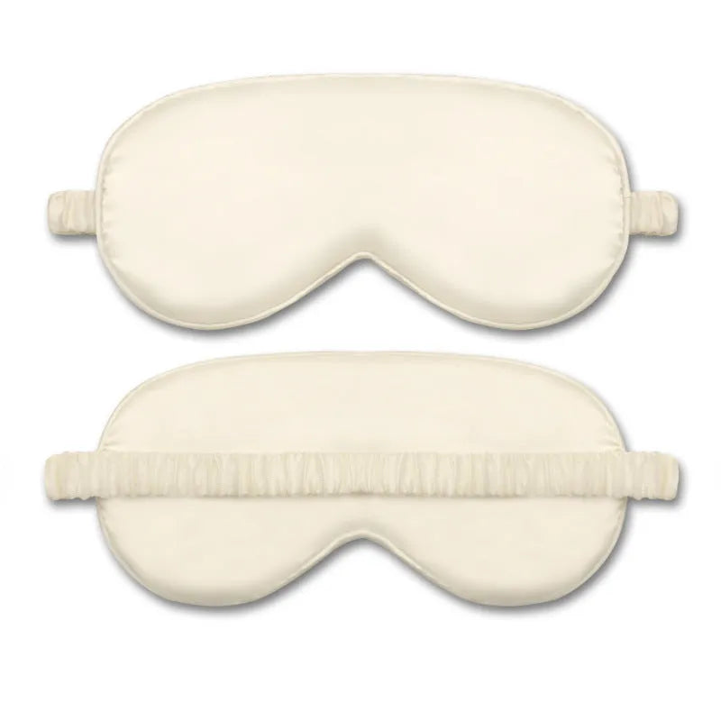 Reversible silk-like sleep eyeshade shown in multiple colour options including sky blue, wine red, and black.