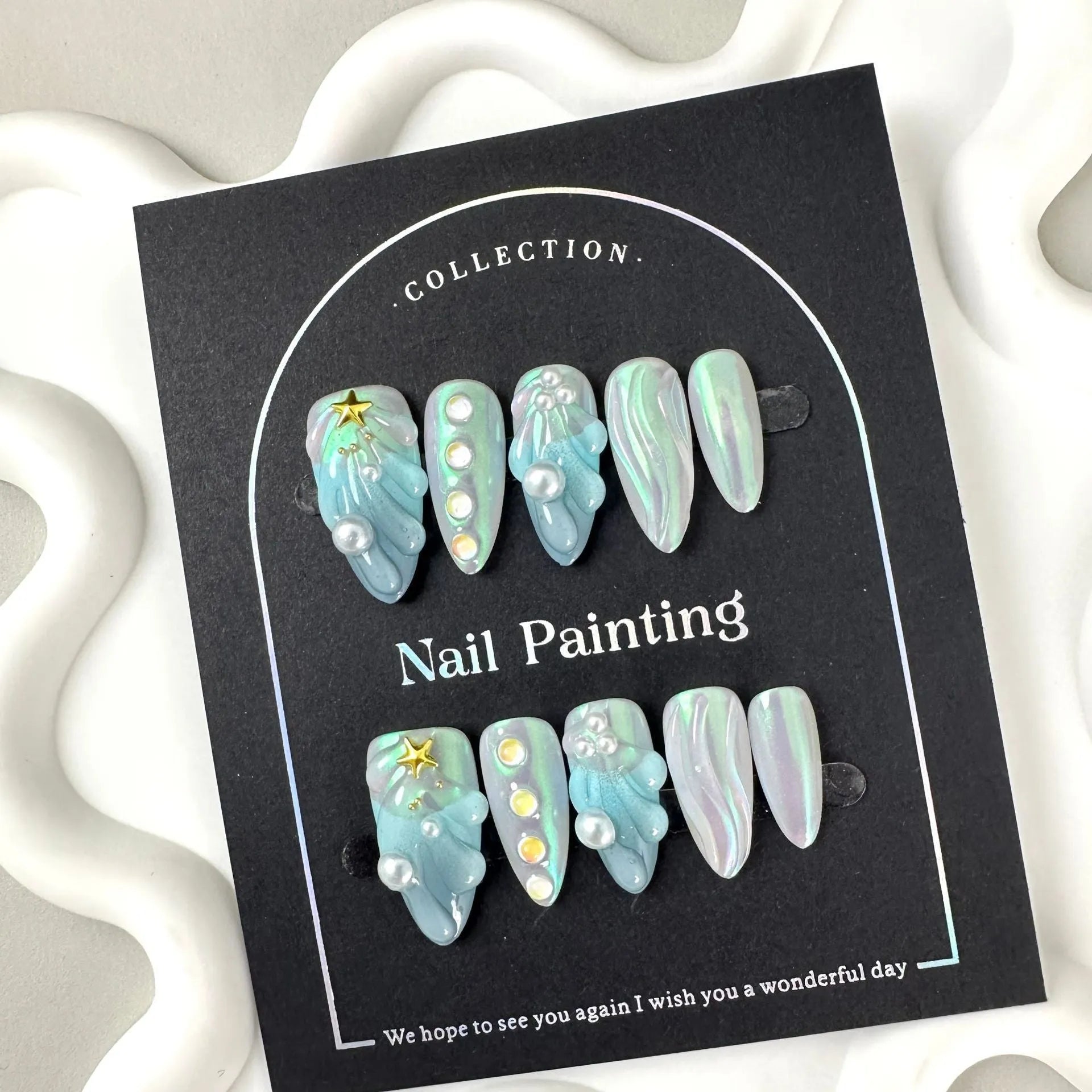 Blue plastic nail tip shells in four sizes for nail extensions and decorative manicures