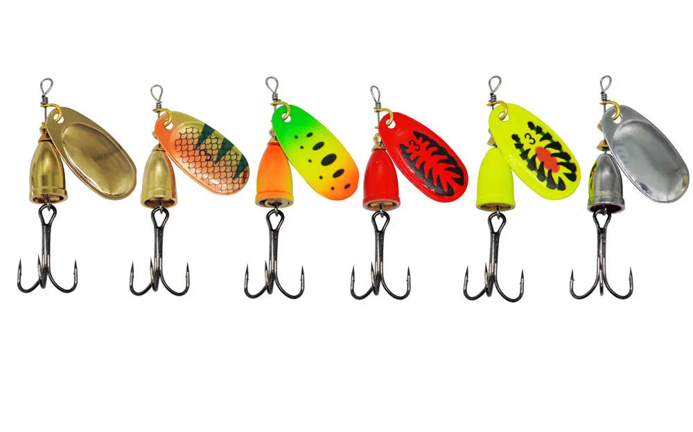 Copper bell metal fishing lure with rotating sequins in seven colour finishes on a blue background.