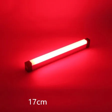 Blue and purple rechargeable dimmable LED tube stick light in 32cm length on a dark surface.