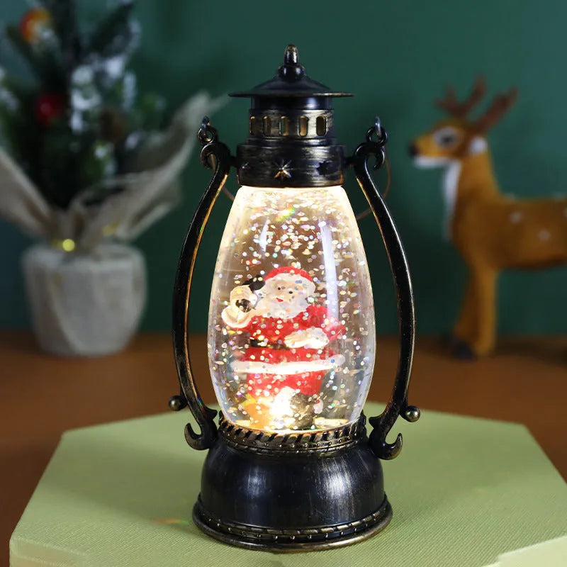 Plastic Christmas desktop oil lamp decoration with a glowing crystal ball and snowman figure.