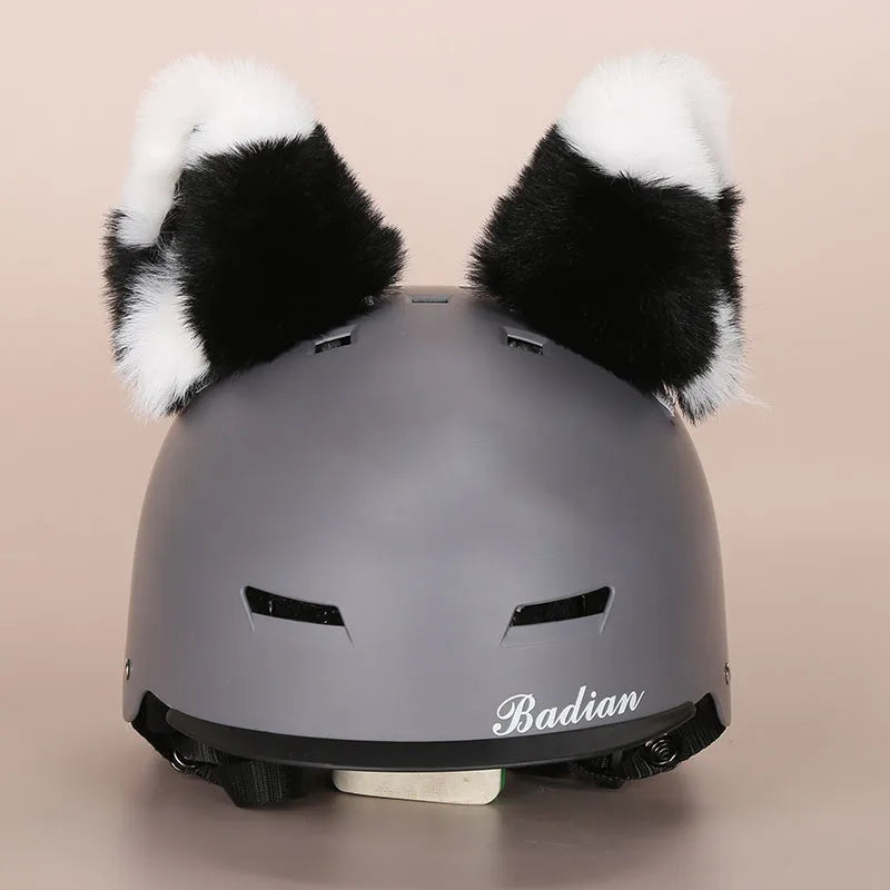 A plush fabric cartoon character helmet hat cover with attached ears on a white background.