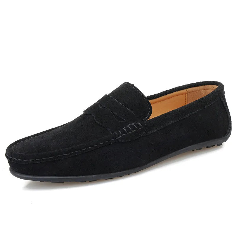 Men's suede slip-on loafers in a solid colour with a round toe and flat rubber sole.