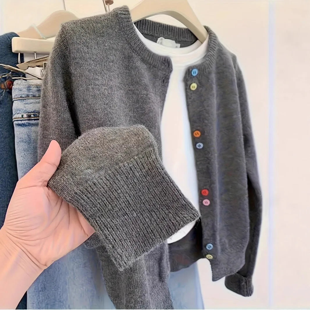 Women's dark grey button-front cardigan sweater with long sleeves on a hanger.