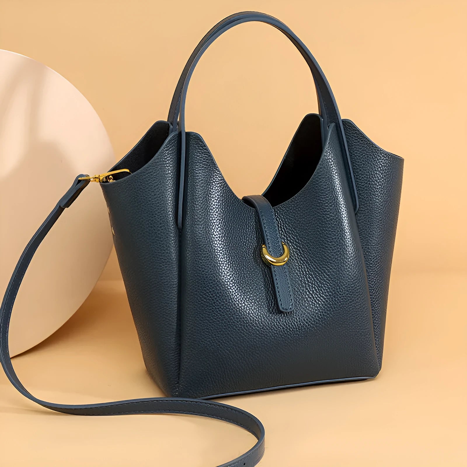 Genuine leather women's retro bucket handbag in beige colour showing sandwich pocket detail