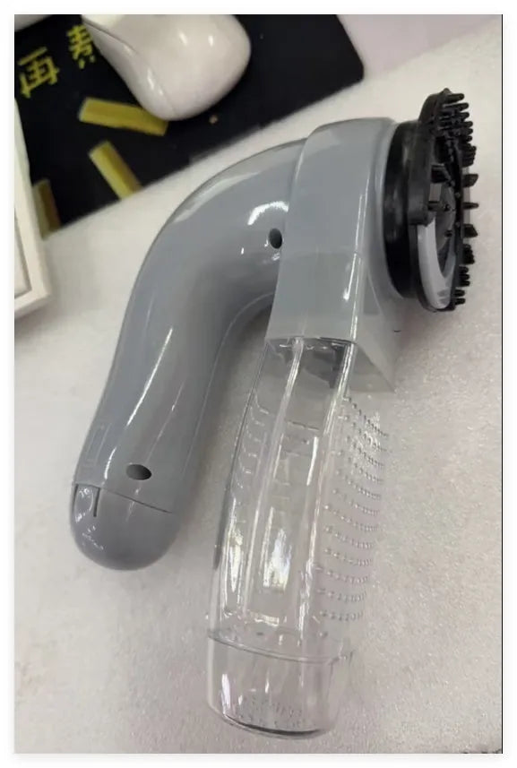 Grey portable electric pet hair vacuum cleaner with soft rubber head for grooming dogs and cats