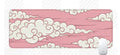 Large cloud pattern rubber desk mat with non-slip base on wooden desk surface