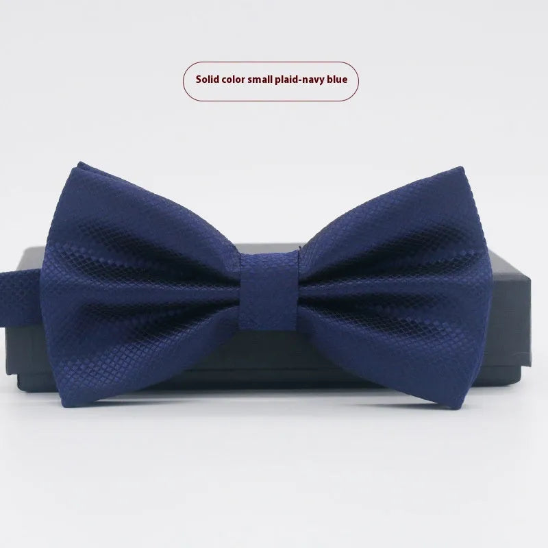 Men's flat head solid colour bow tie in polyester, showing 12cm by 6cm size on a background.