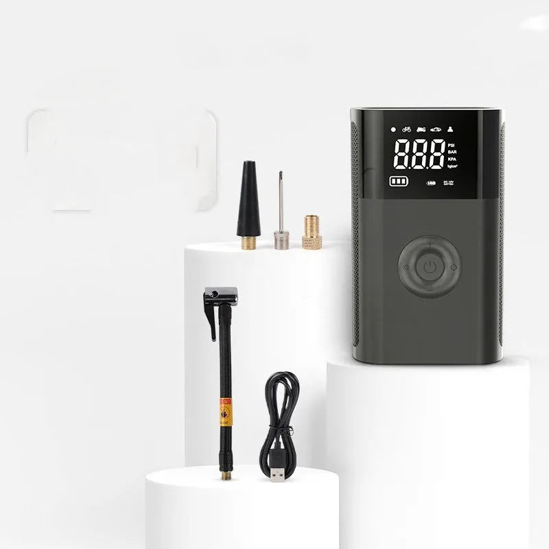 Black wireless digital tyre inflator pump with digital display and multiple nozzle attachments
