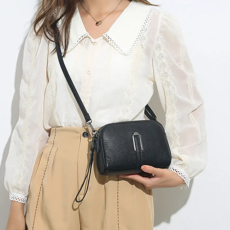 Women's genuine leather square shoulder bag in dark khaki colour, showing its structured shape and shoulder strap.
