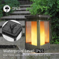 Black antique flame-shaped solar LED garden light with solar panel on top for outdoor pathway illumination