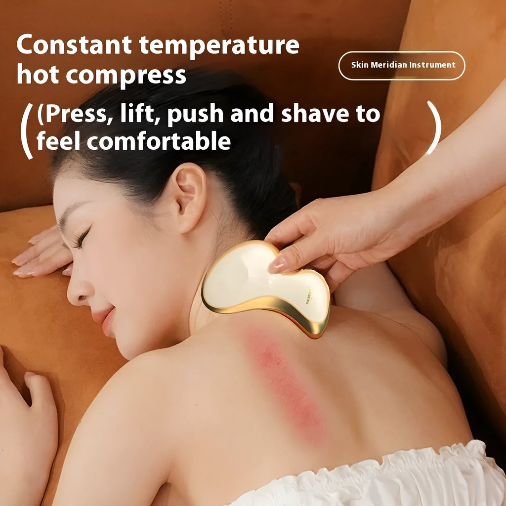 Gold coloured electric Gua Sha facial massage tool with a smooth metal scraping plate.