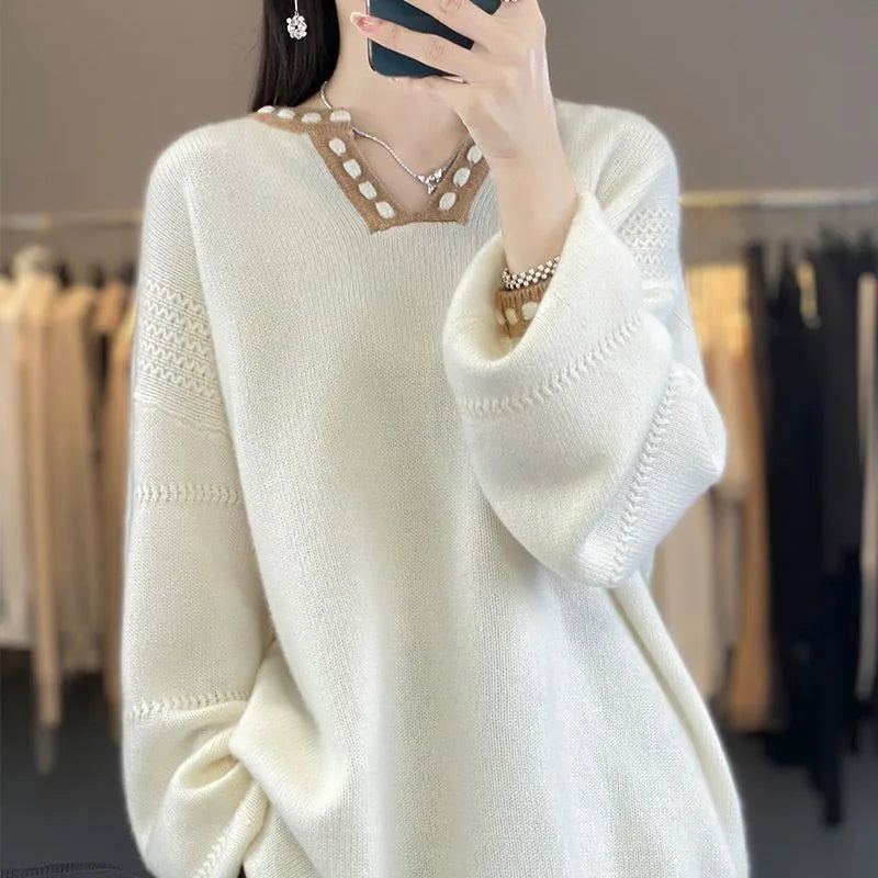 Women's white V-neck viscose sweater with long sleeves on hanger