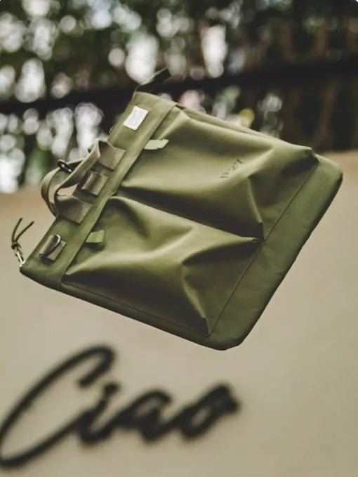 Marden Tooling charcoal black nylon canvas messenger bag with shoulder strap shown open.