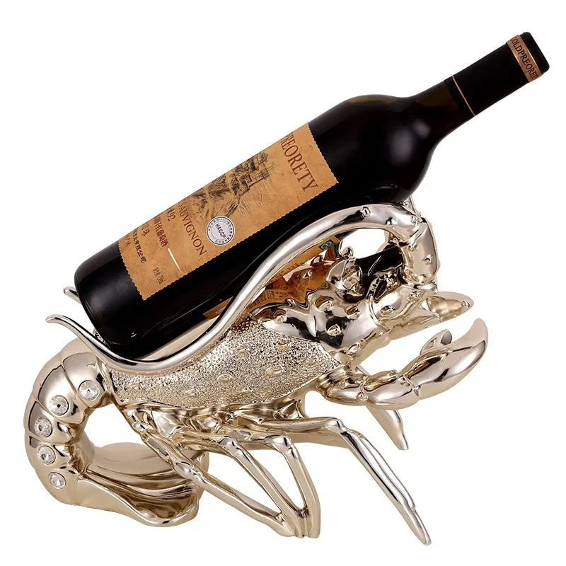 Lobster-shaped decorative wine rack ornament in metallic rose gold holding a wine bottle.