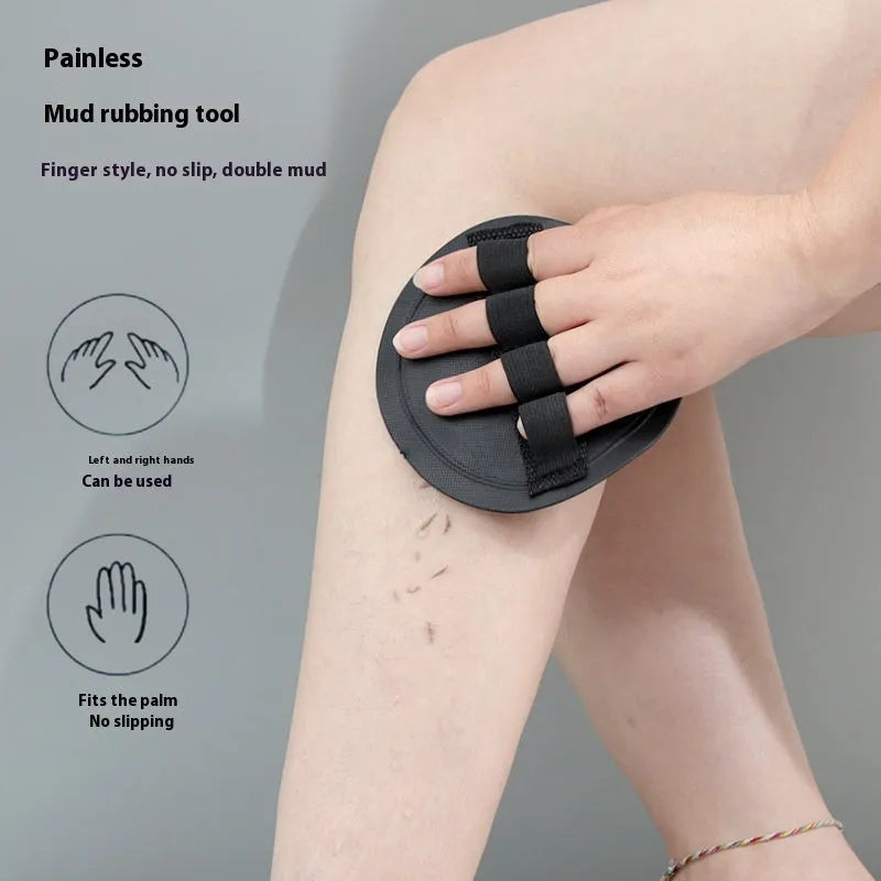 Rubber finger style massage gadget in round cake colour with bath towel