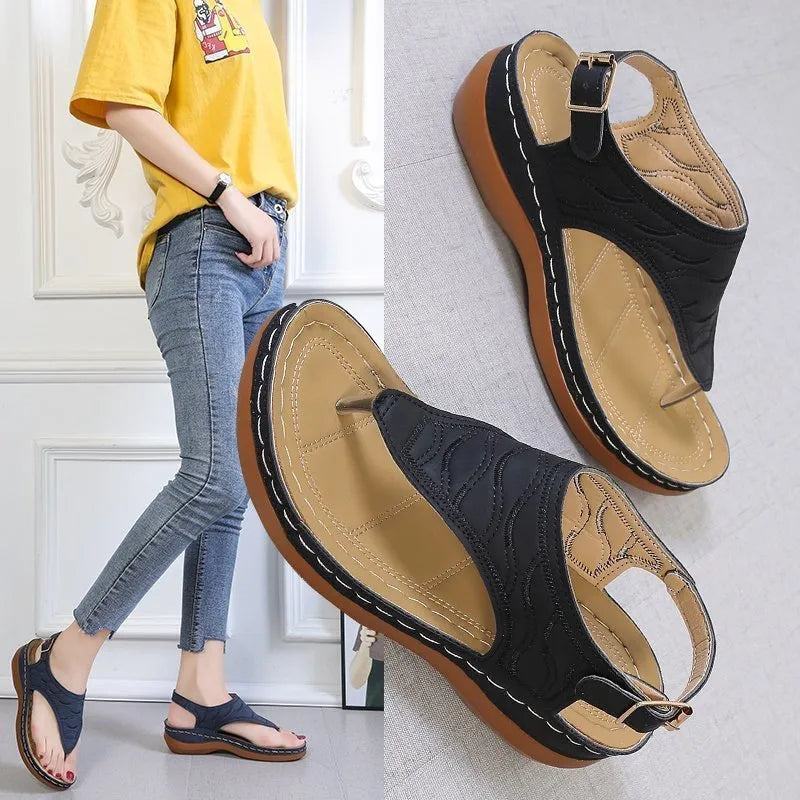 Women's casual wedge heel flip flop sandals with an adjustable back strap in solid colours.