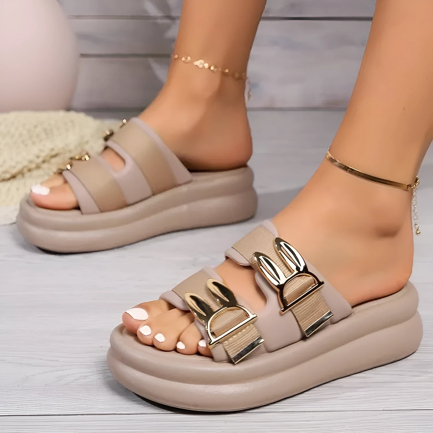 Women's apricot suede slippers with a thick rubber sole, shown on a white background.