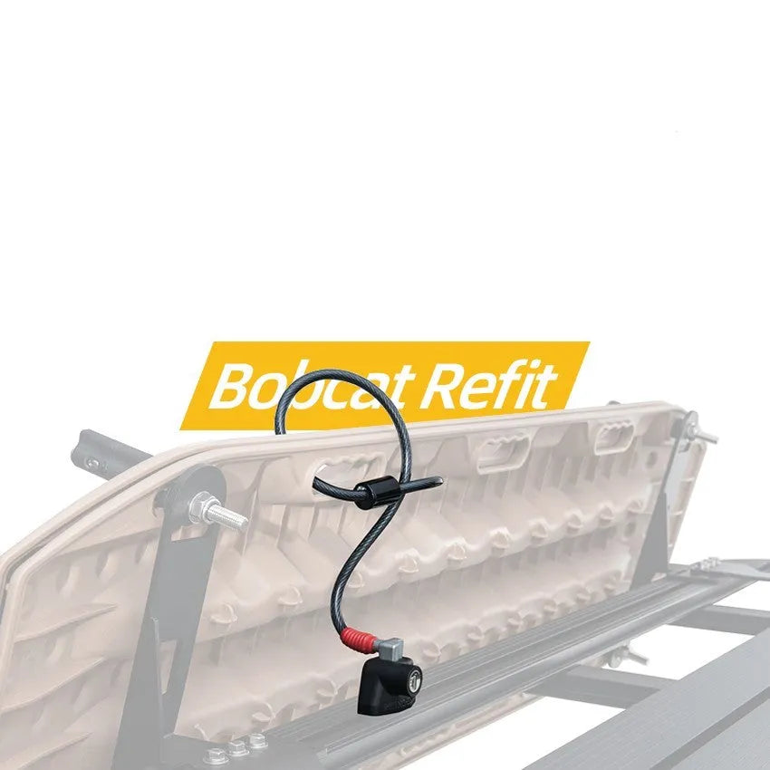 Roof platform steel cable lock with plastic sheath securing a kayak to roof bars.