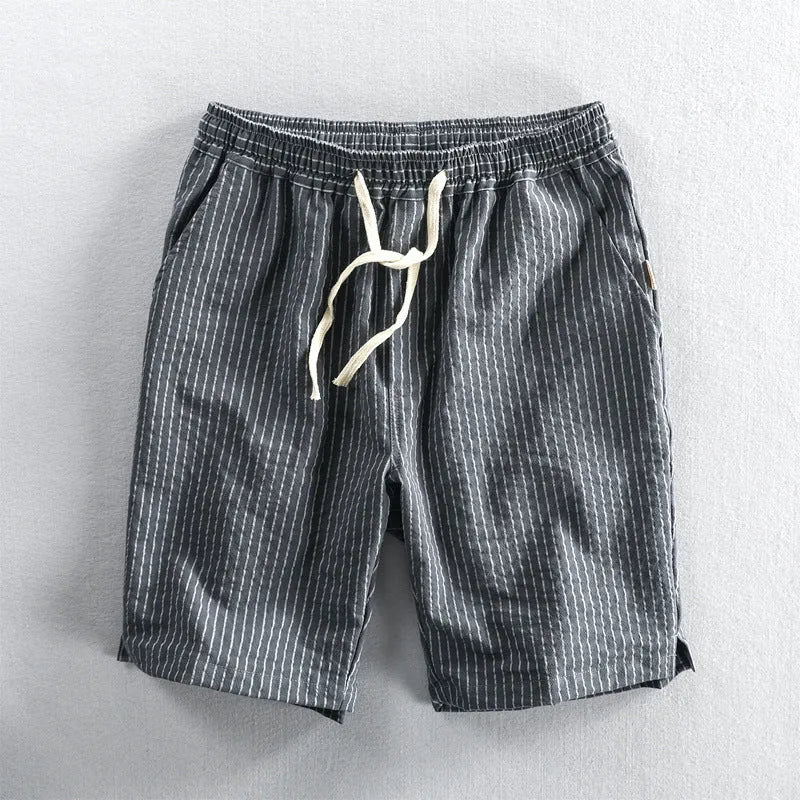 Men's striped cotton casual shorts showing straight-leg design and mid-waist fit