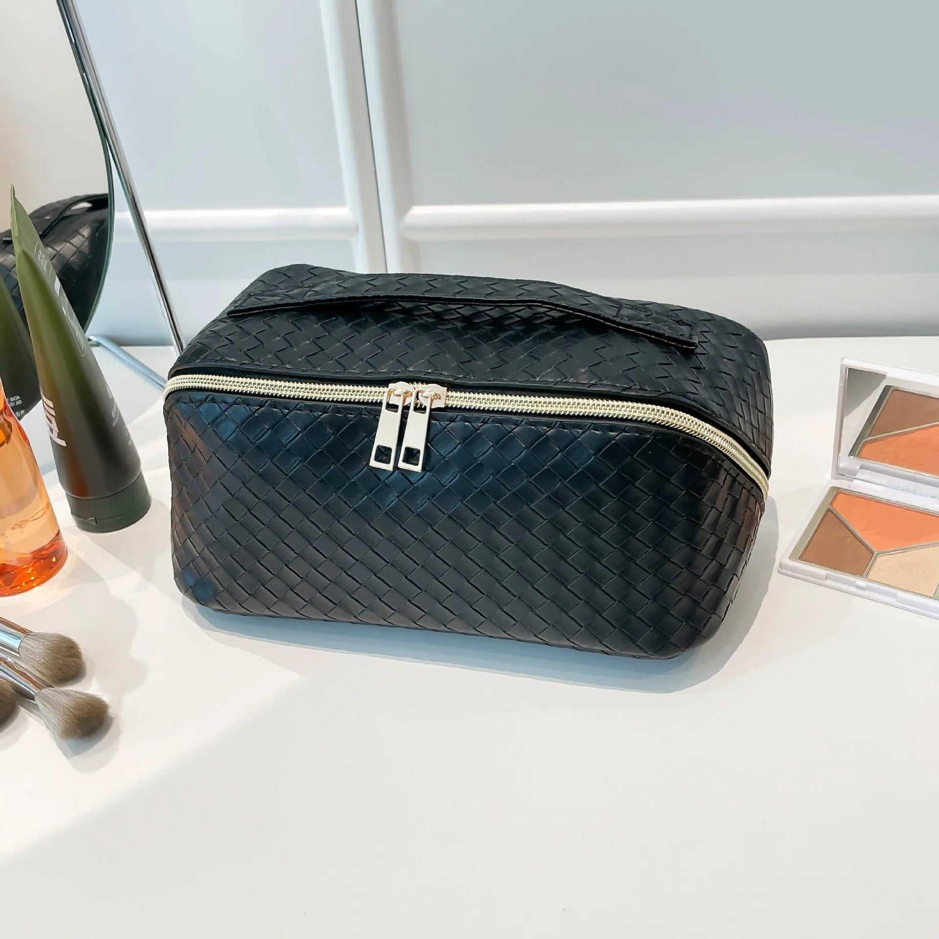 Waterproof large capacity storage bag in black, showing PU material and zip closure
