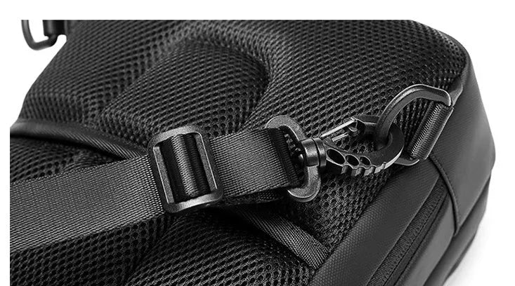 Black Oxford cloth multifunctional crossbody bag for men with zipper closure and shoulder strap on neutral background
