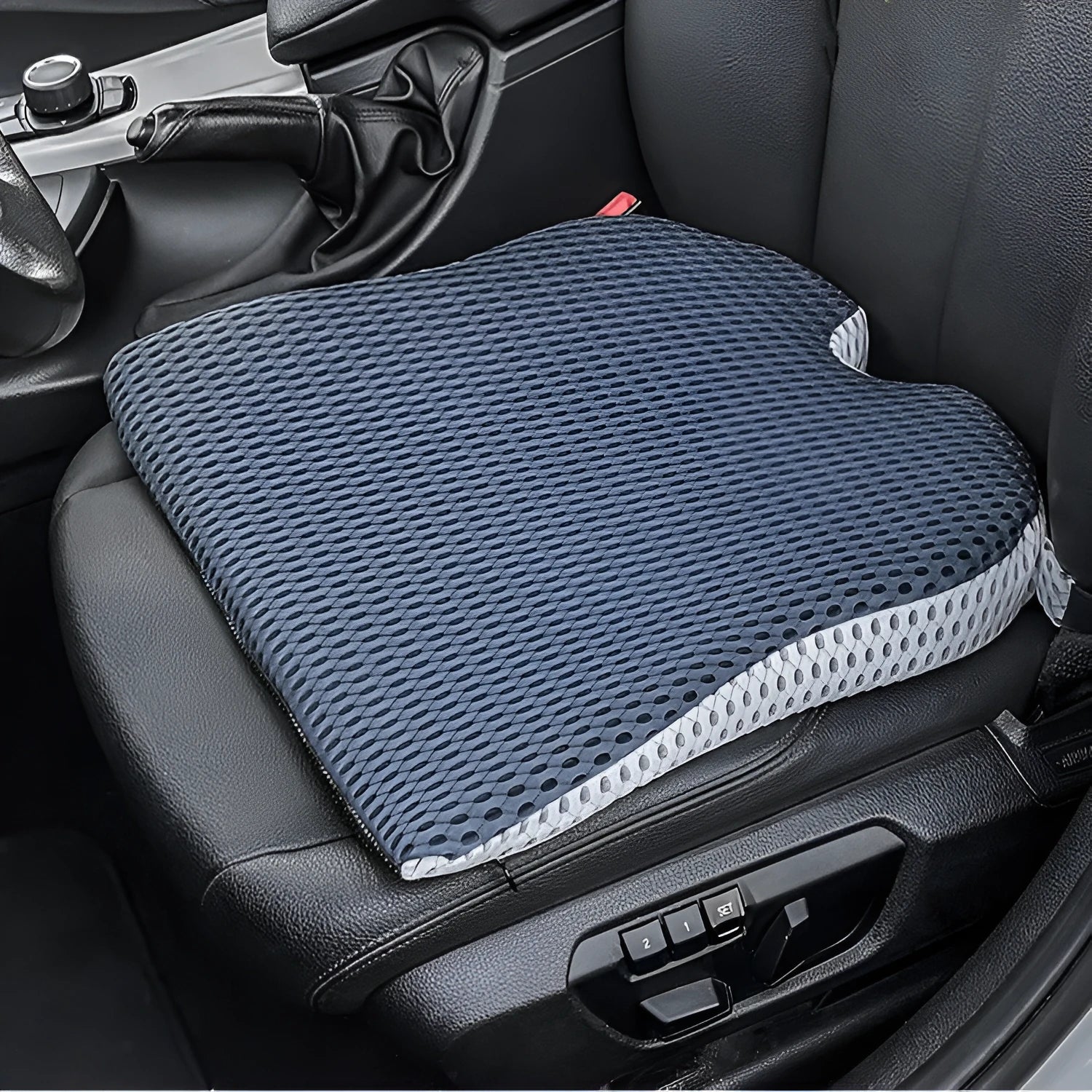 Memory foam car and office chair cushion with an attached fixed strap in a solid colour.
