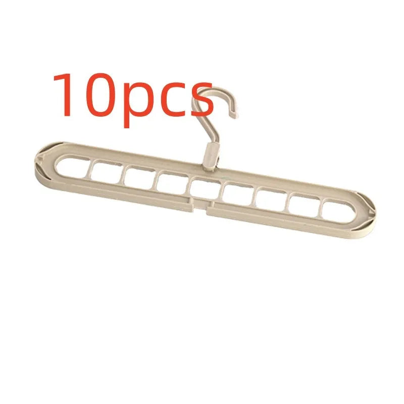 Green plastic nine-hole folding hanger for trousers displayed open and closed.
