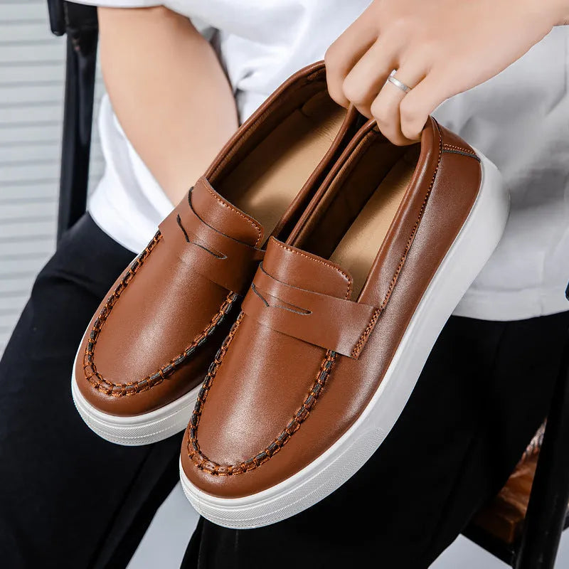 PU leather casual slip-on shoes in round toe design available in white, black and white, and khaki colour options