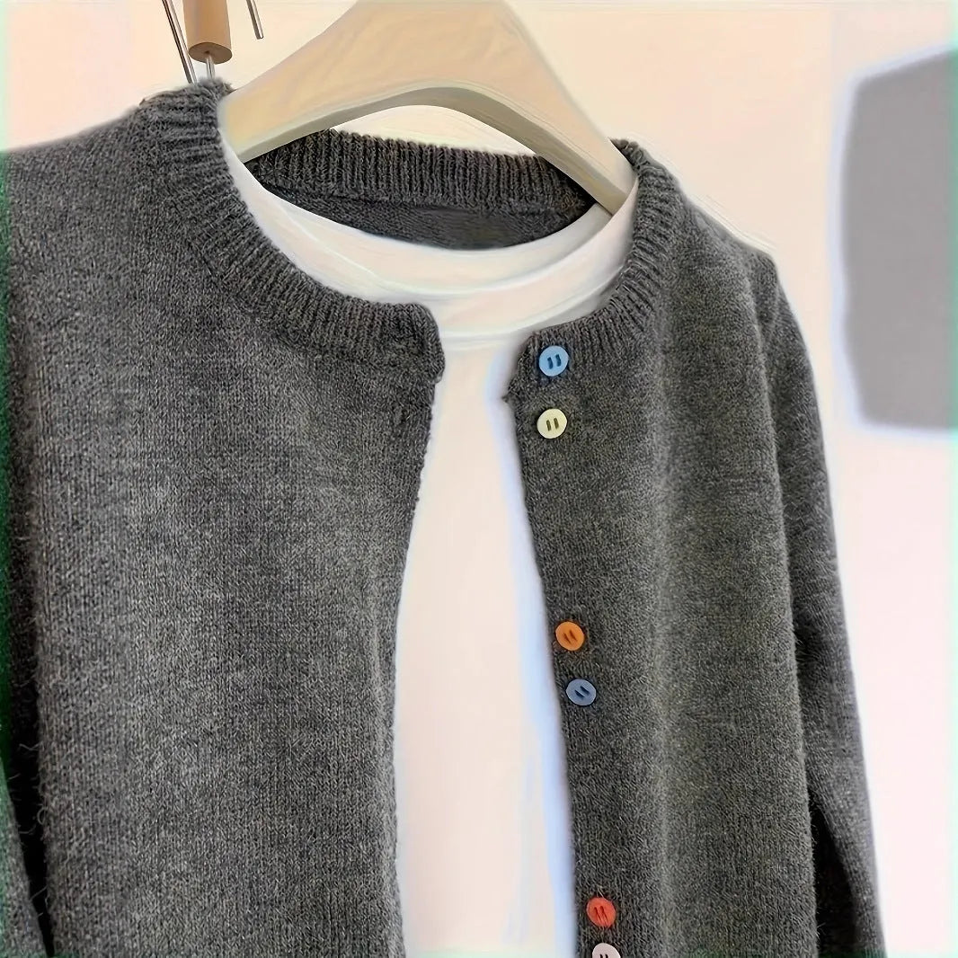 Women's dark grey button-front cardigan sweater with long sleeves on a hanger.