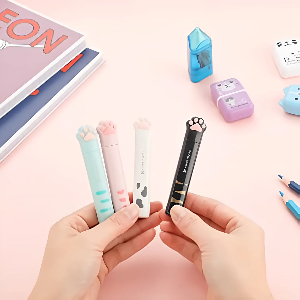 Folded cat paw mini scissors in stainless steel and plastic available in pink blue black and white colours measuring 8.7cm