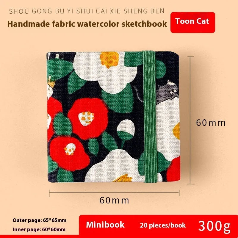 Feiluniao handmade fabric watercolour sketchbook with colourful themed cover, 185mm long.