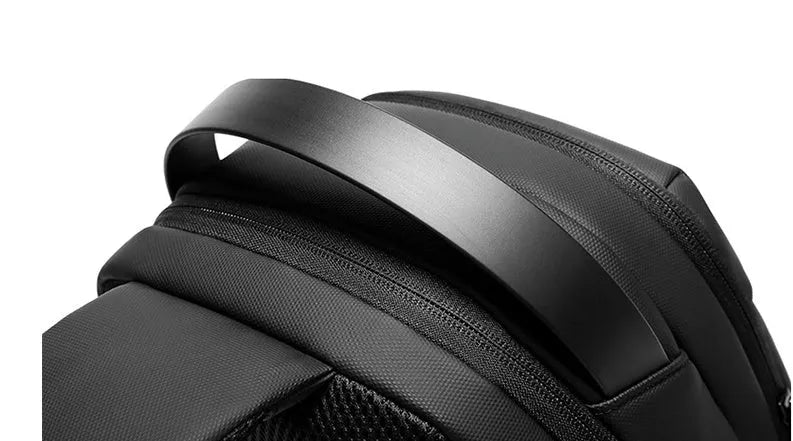Black Oxford cloth multifunctional crossbody bag for men with zipper closure and shoulder strap on neutral background