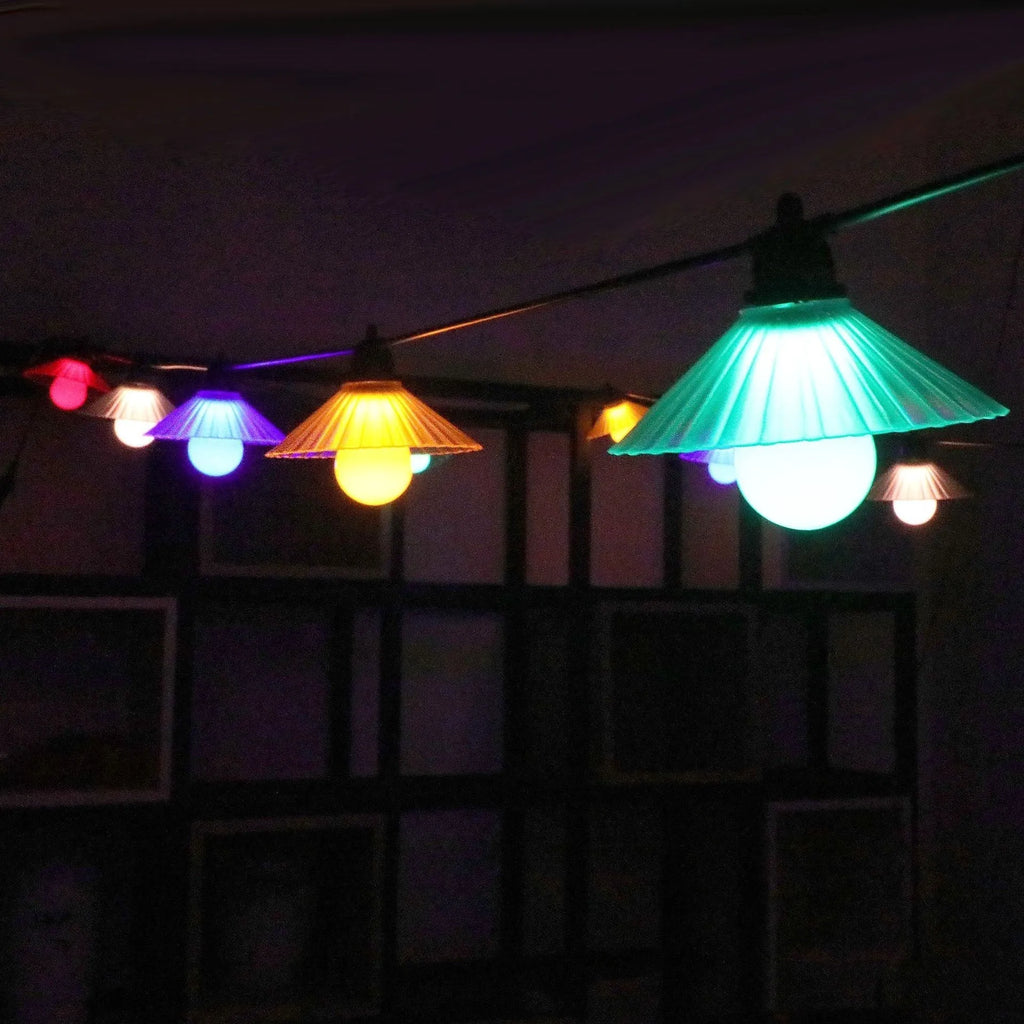 Outdoor waterproof LED string lights with flower-shaped globes in warm white and multi-colour options.