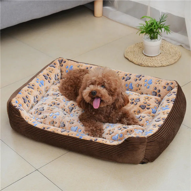 Soft beige plush dog bed with raised sides in a sofa-style design for small pets.