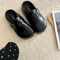 Flat buckle casual sneakers in yellow, black, silver, and creamy-white colours with rounded toe shape