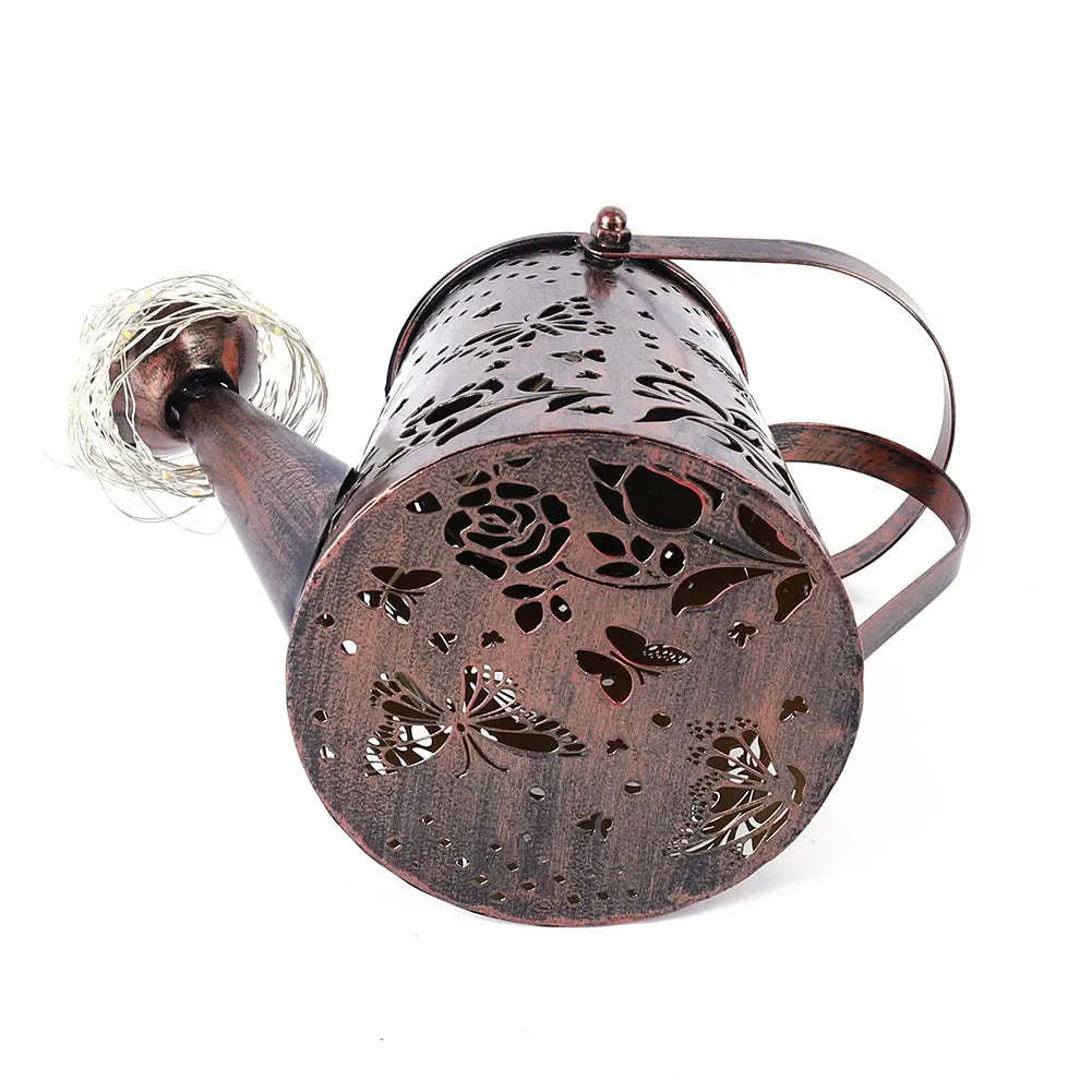 Iron solar garden lamp with tapered butterfly pattern and warm white LED lighting