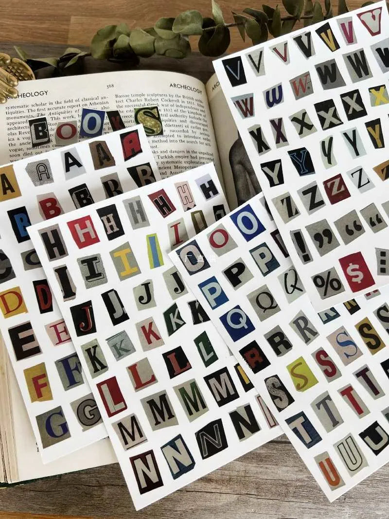 Set of printed English letter, number, and weekly word decoration stickers in assorted colours, laid out flat.