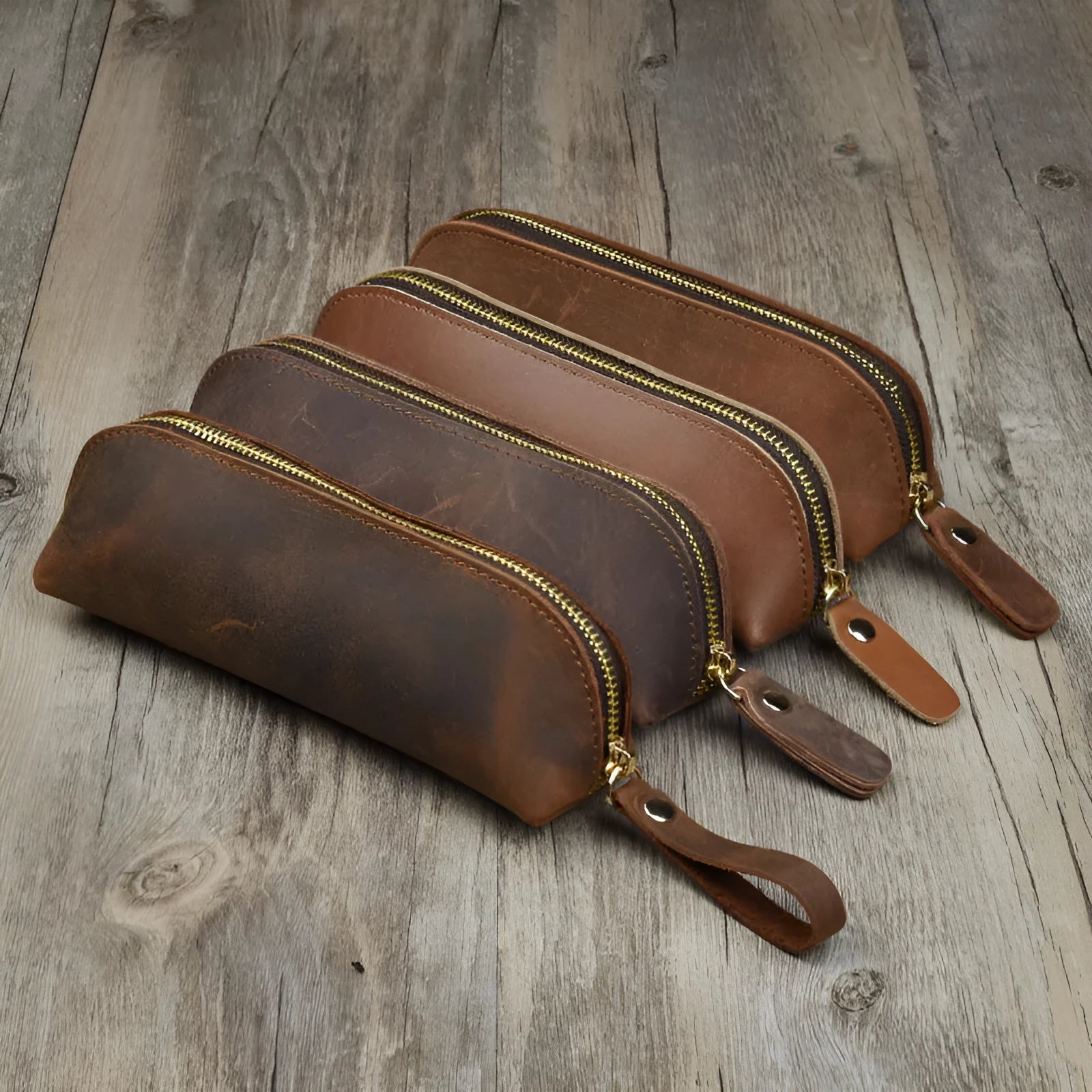 Square leather pencil case with zipper closure in black, brown, dark brown, or yellow colour