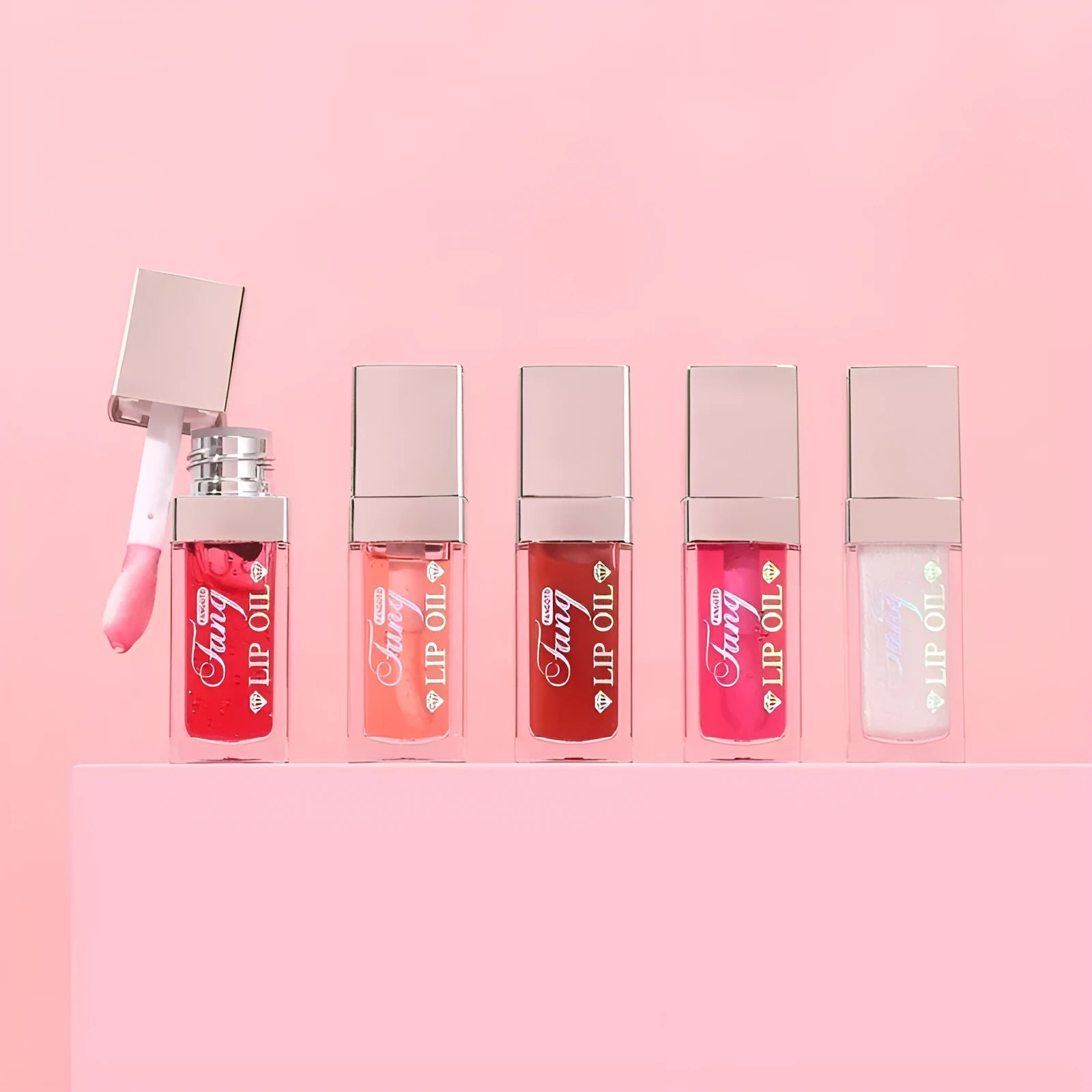 Five colour options of bright lip gloss mint lipstick with moisturising lip essence oil applicator