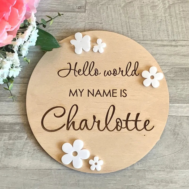 Square wooden baby name plaque showing newborn birth information, 15cm on each side.