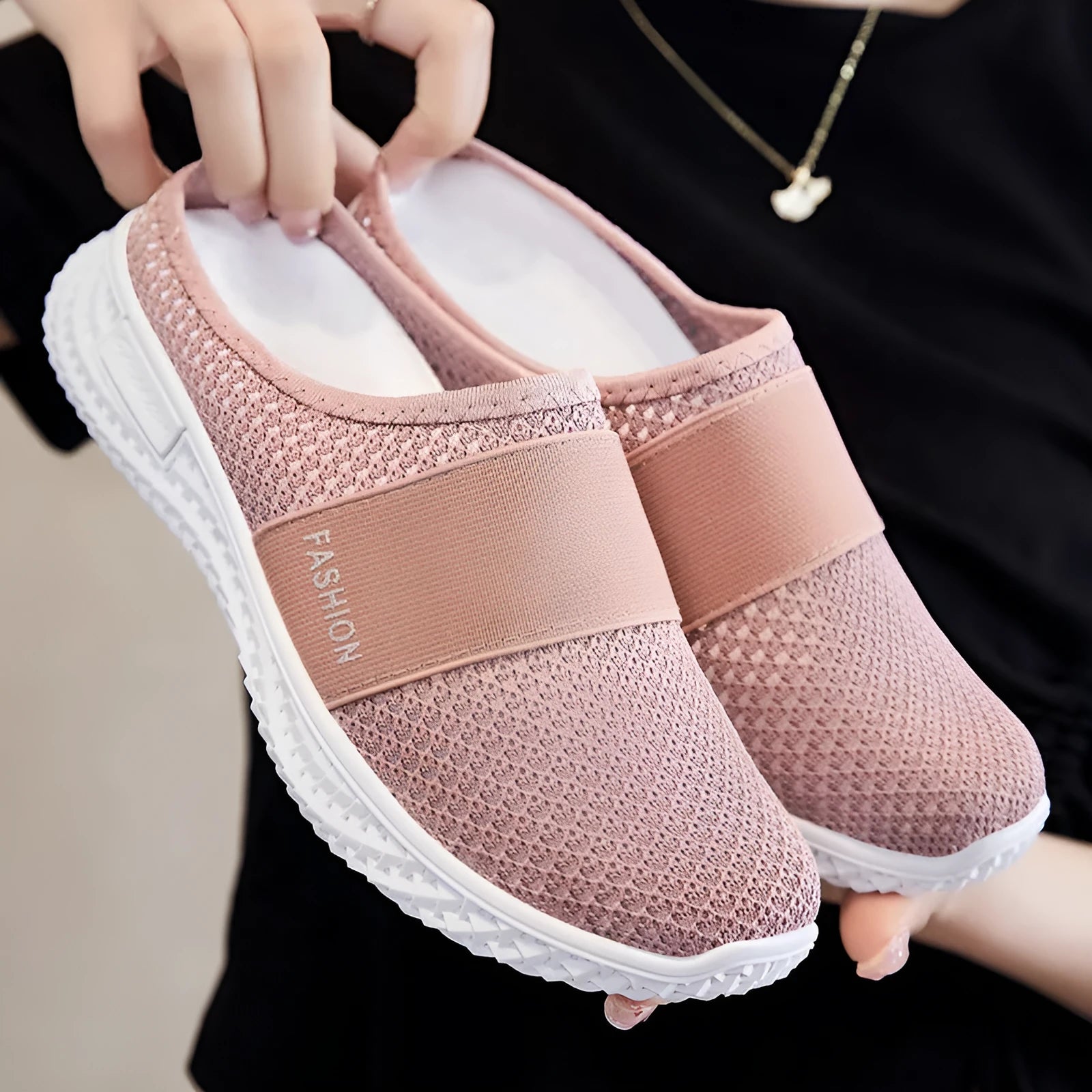 Women's breathable mesh casual shoes with hollow-out design and flat heel in round toe style.