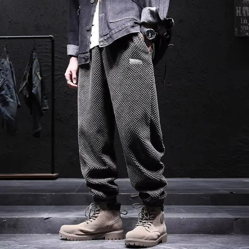 Men's grey ankle-tied sweatpants with straight leg cut and adjustable cuff ties