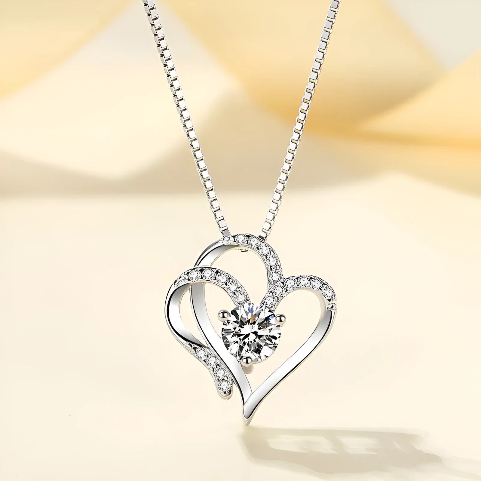Women's heart-shaped 925 silver necklace shown in rose gold, white gold, and yellow gold plating options.