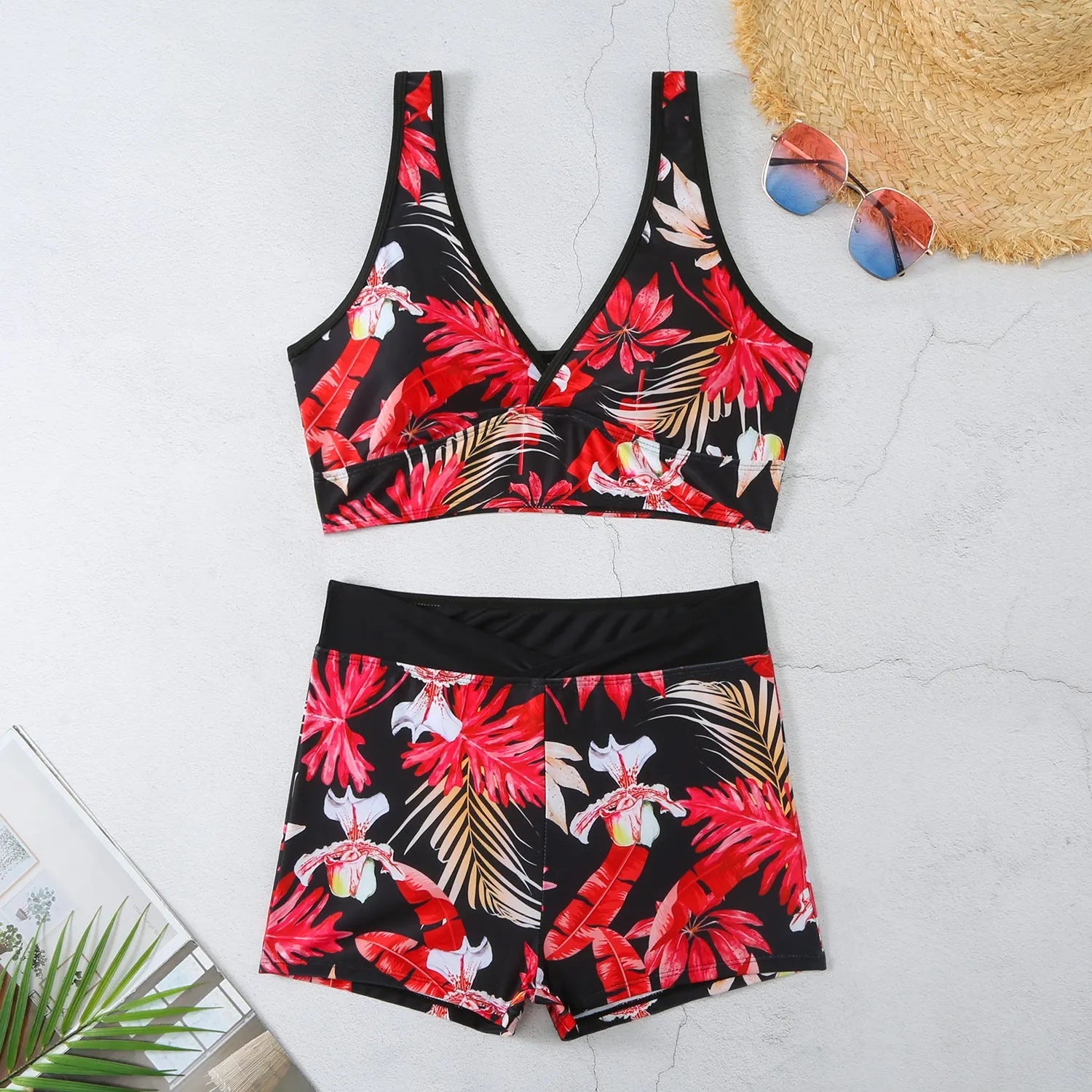 Women's two-piece sleeveless swimsuit with boxer shorts in a multi-colour print.