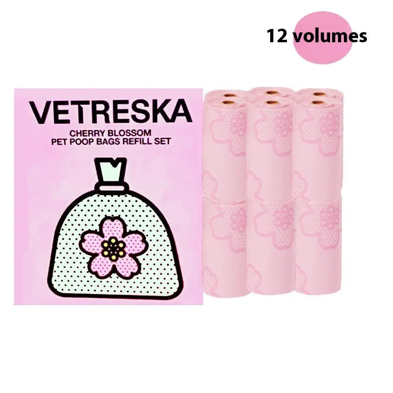 Refillable plastic dog poo bag dispenser capsule with a roll of scented biodegradable bags in strawberry design.