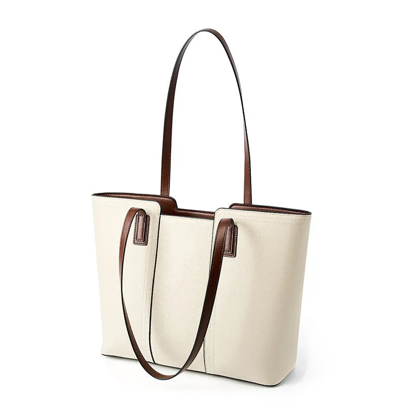 Women's black horizontal square leather commuter shoulder bag with crossbody strap and internal organiser pockets.