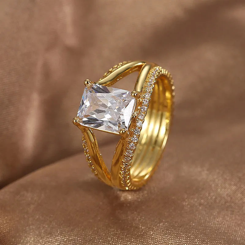 Geometric gold electroplated ring with square zircon stone showing European styling